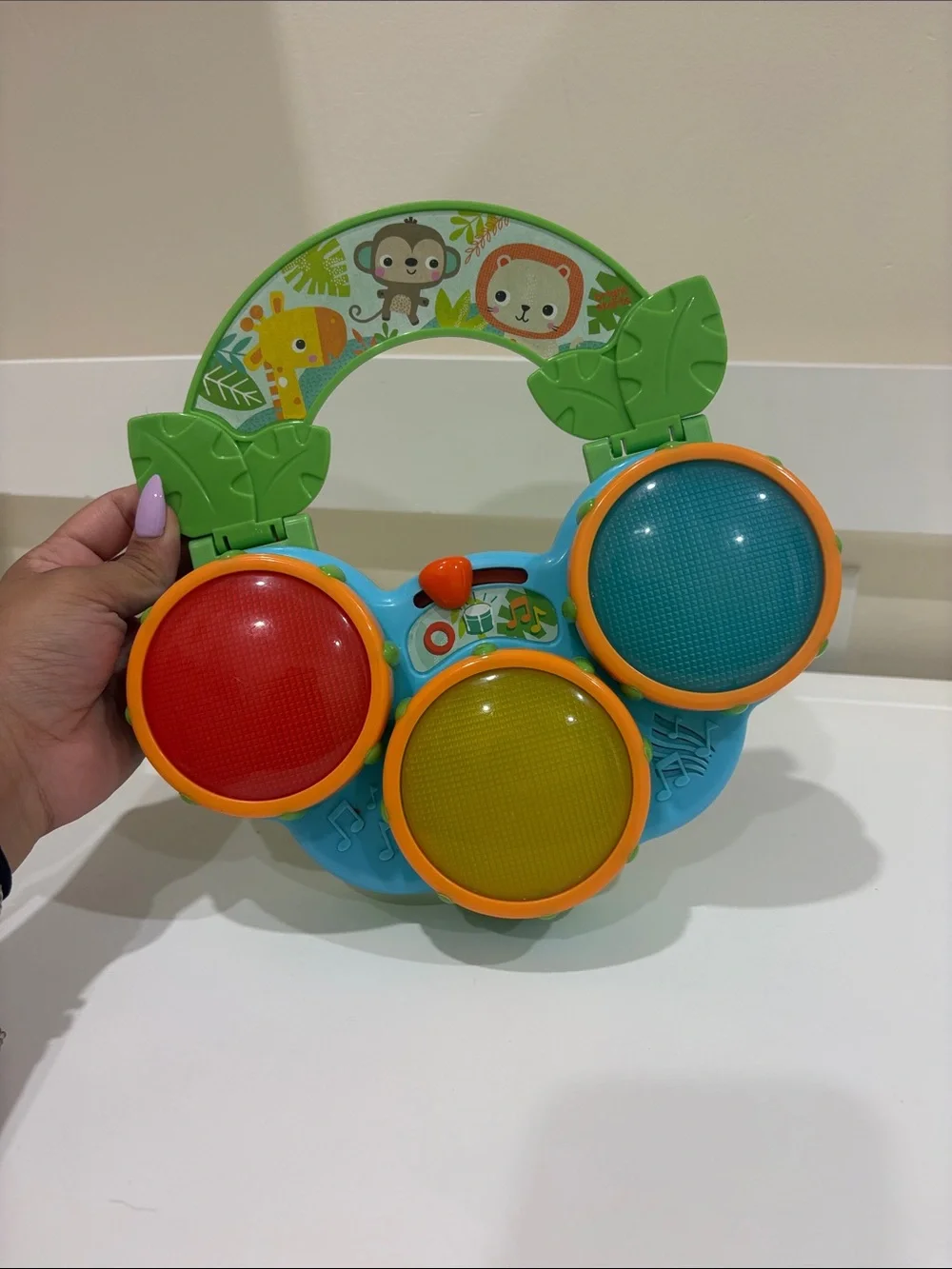 Toddler Jungle Drum Toy – Green Handle with Red, Yellow & Blue Pads